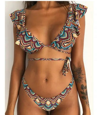 Yellow floral print split bikini swimsuit set on a mannequin, showing backless design.