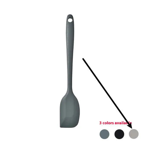 Silicone kitchen utensil set with twelve tools in a rotating white storage caddy on a counter.