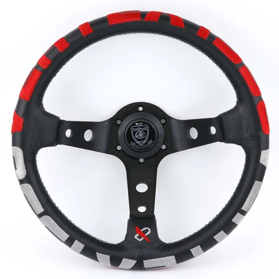Black alloy racing steering wheel with deep concave rim and star embroidery pattern.