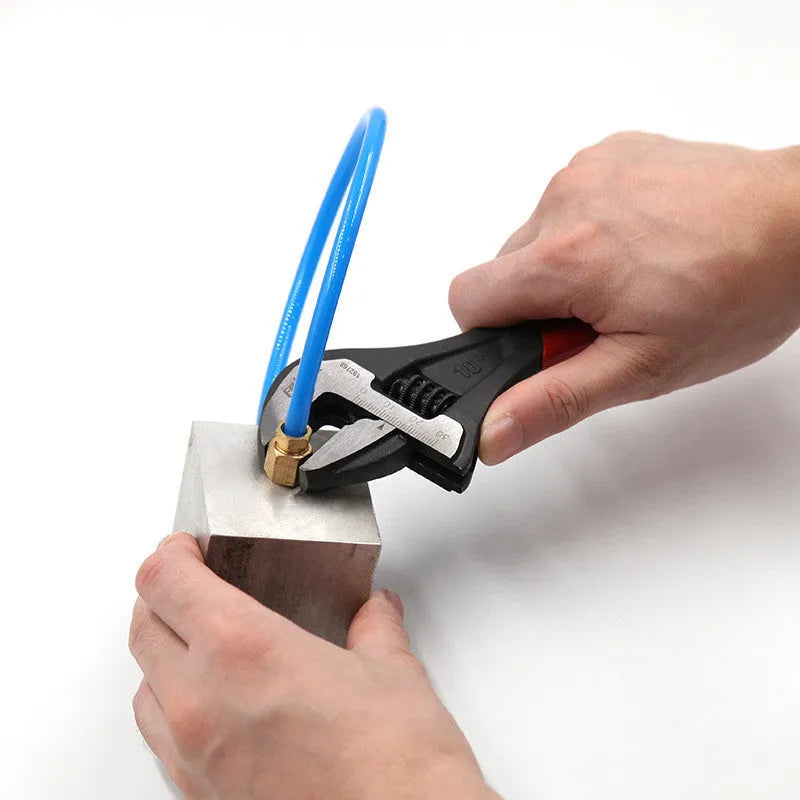Orange manual multi-function wrench with 300mm length and 36mm jaw opening on a workbench