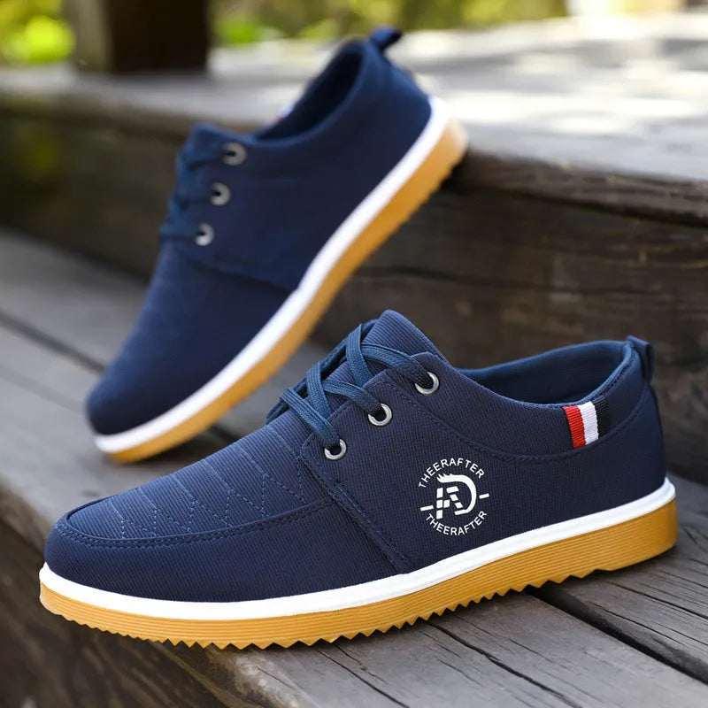 Men's black canvas casual shoes with leather toe cap and non-slip platform sole.
