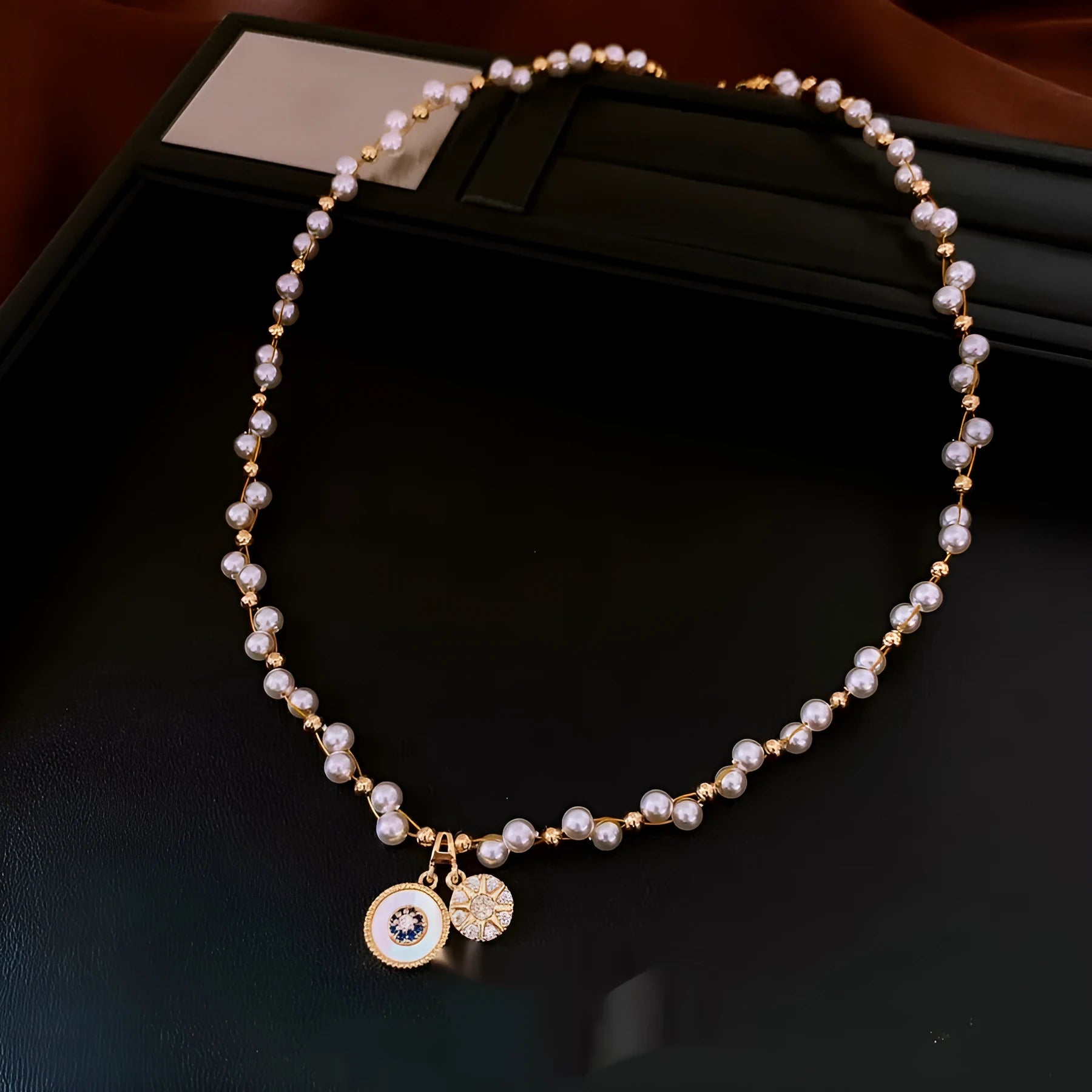 Gold electroplated necklace with round zircon and imitation pearl pendant on clavicle chain