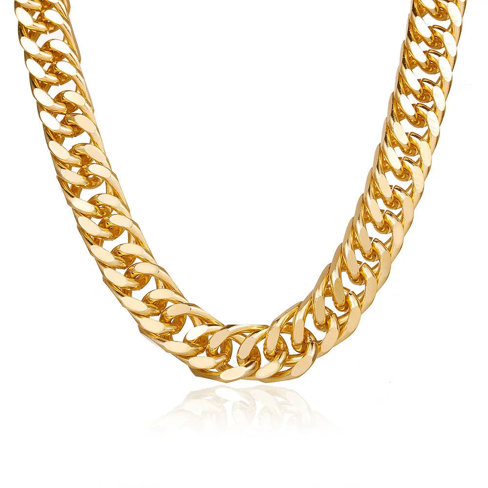 Gold electroplated women's necklace with thick chain and teardrop pendant on a grey background.