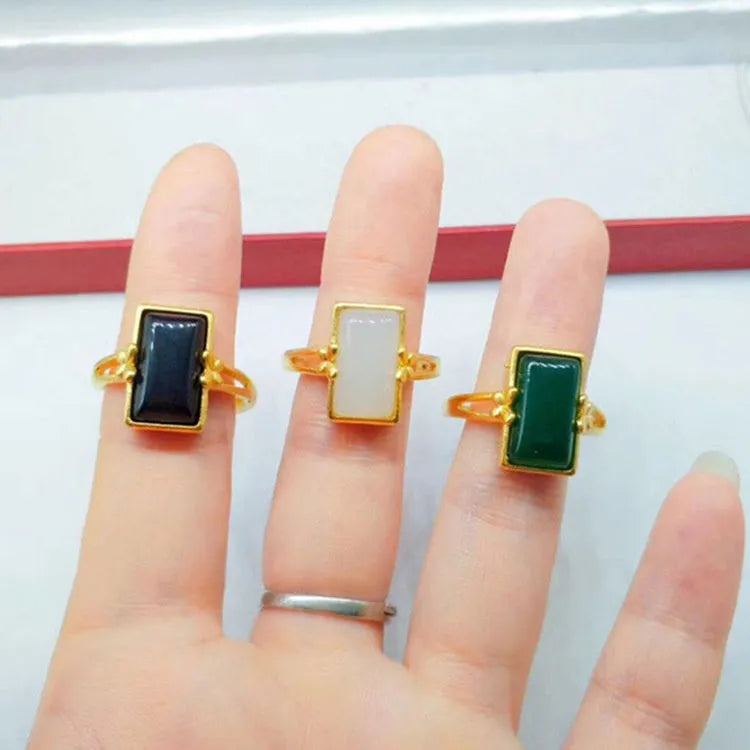 Adjustable brass gold-plated ring with a green gemstone inlay in a national style.