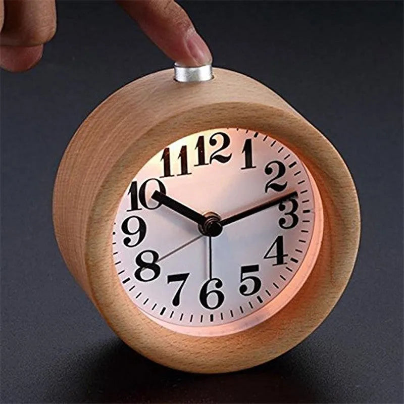 Solid beech wood analogue alarm clock with silent snooze on wooden surface