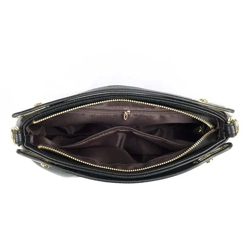 Genuine leather crossbody bag with pleated shoulder strap and wrinkled composite leather finish in horizontal square shape