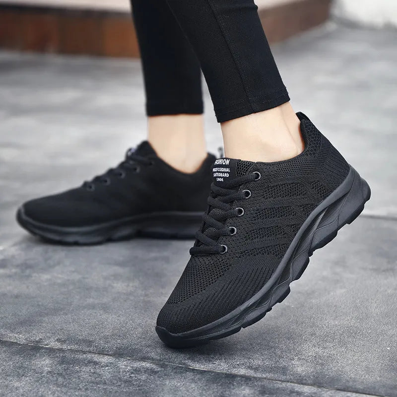 Women's mesh breathable running shoes with Flyknit upper, flat heel, lace-up closure, in white, black, and black-pink colourways
