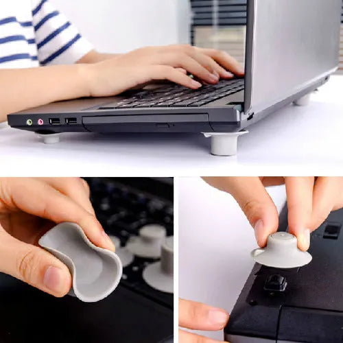 Set of four grey plastic laptop cooling pads with non-slip rubber feet, shown elevating a silver laptop.