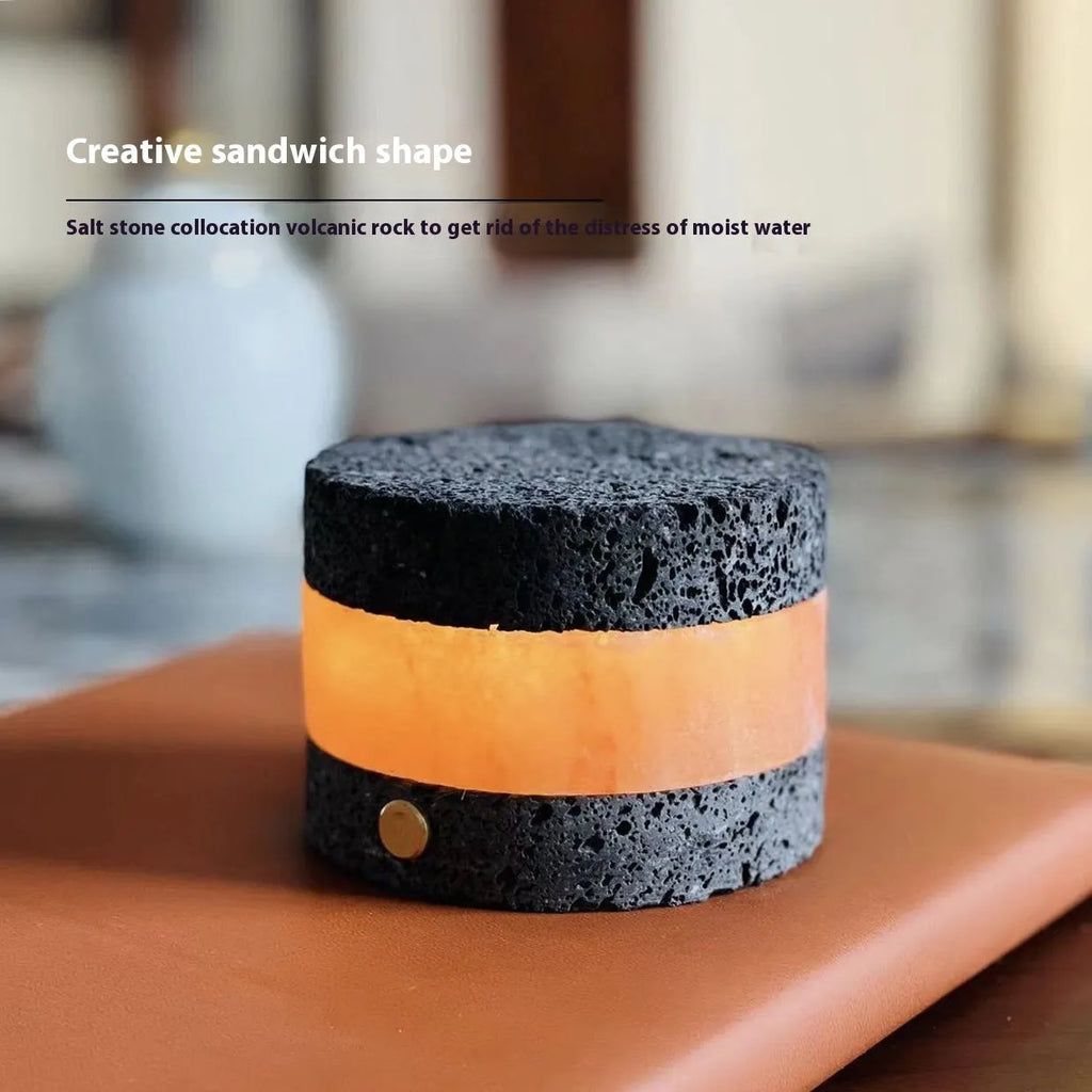 Small orange volcanic rock touch lamp with USB port and essential oil well in warm white.