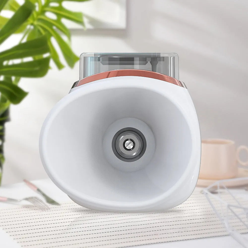 White and purple household eye humidifier device with USB charging cable on plain background