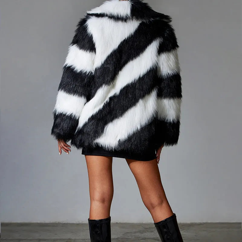 Black and white contrast lapel faux fur coat with a fur collar, shown on a model.