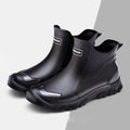 Men's short PVC rubber boots in black with a non-slip flat sole.