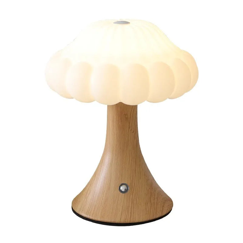 Small mushroom-shaped touch sensor night light showing USB charging port and woodgrain colour finish.