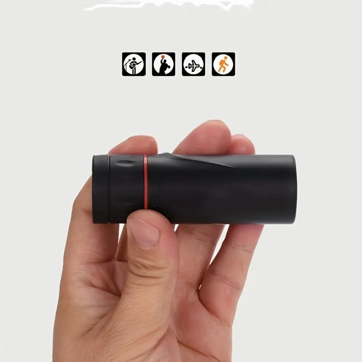 Black monocular telescope with mobile phone holder attached, showing compact single-tube design