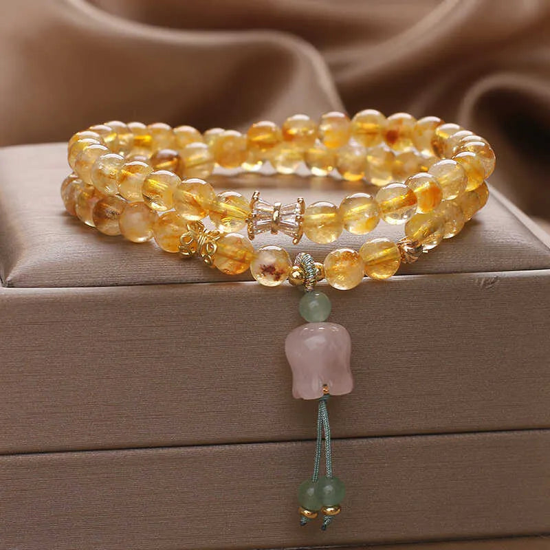 Women's crystal bracelet with natural gold rutilated quartz yellow tower double ring Lily pendant, pearl and rhinestone accents, 34cm length