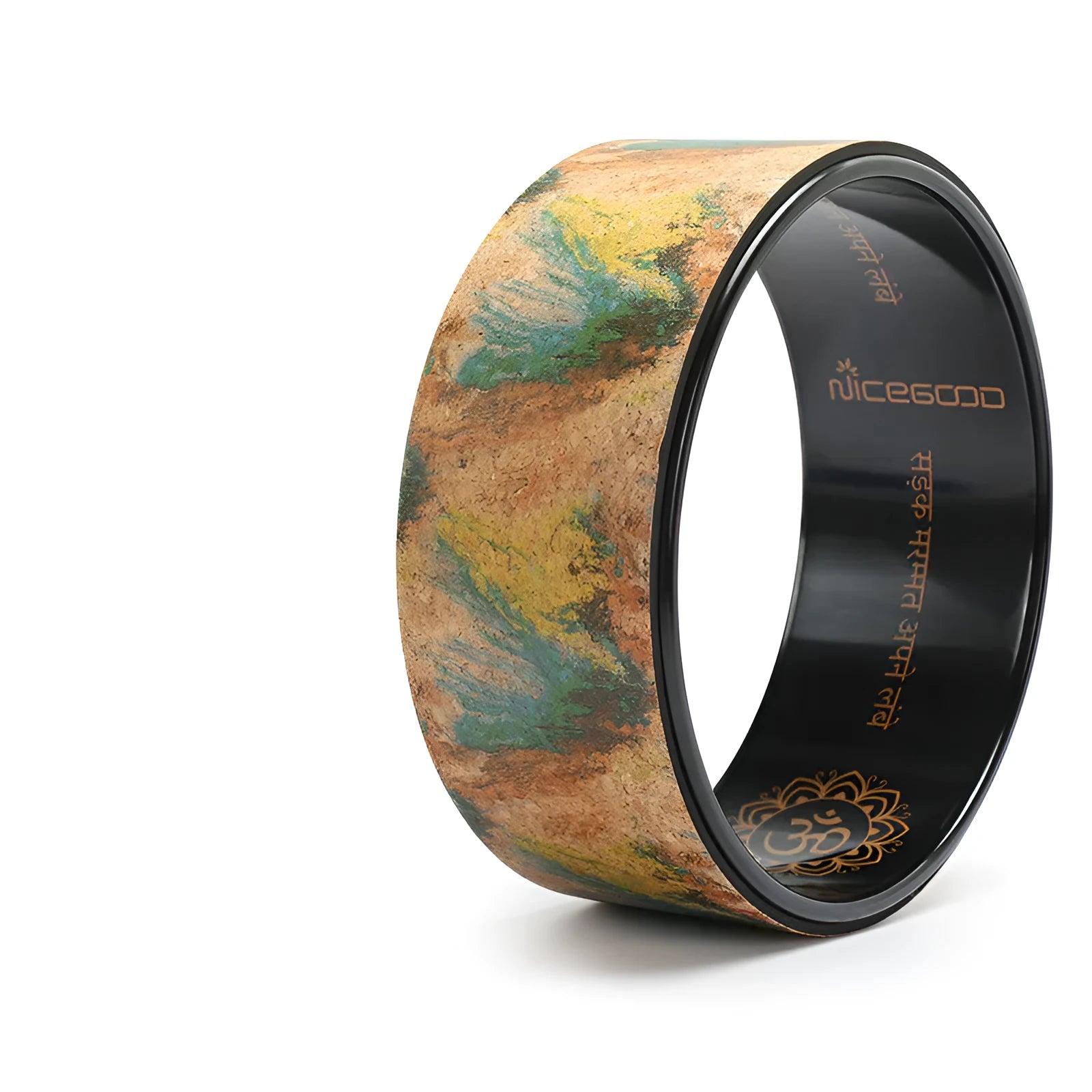 Cork yoga wheel in classic black, 32cm diameter, on a yoga mat in a home studio