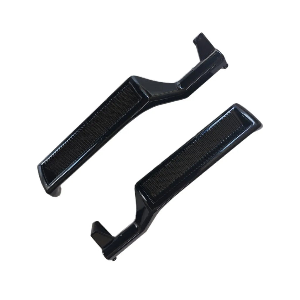 Pair of black zinc alloy automobile interior door handles, one left-hand and one right-hand.