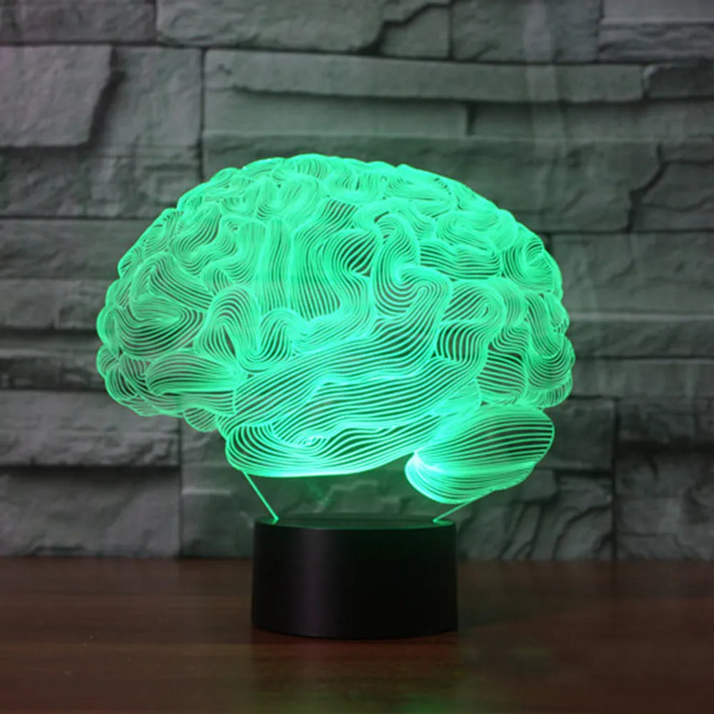 3D acrylic illusion desk lamp with colourful LED lights on a wooden desk, remote control nearby.