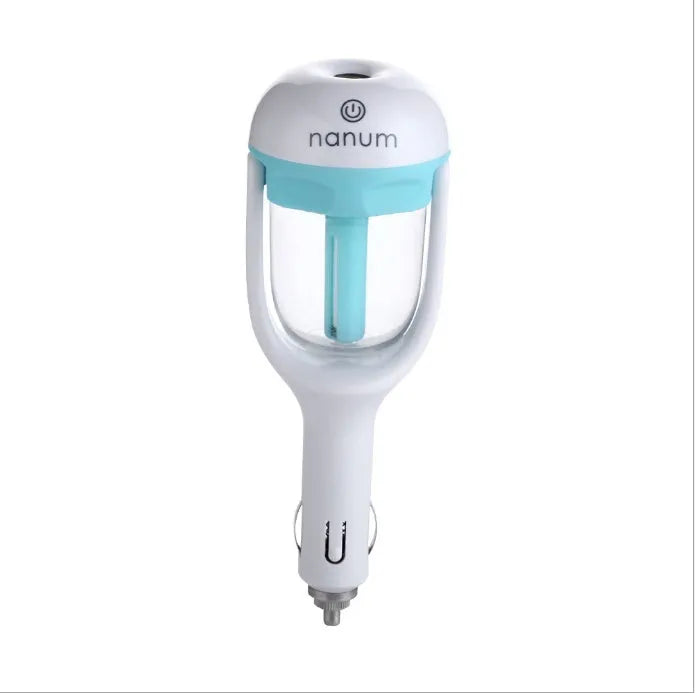 Blue portable car humidifier with rotating nozzle on a car dashboard