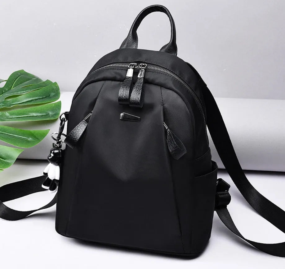 Medium wine red Oxford cloth rucksack showing internal phone and ID compartments