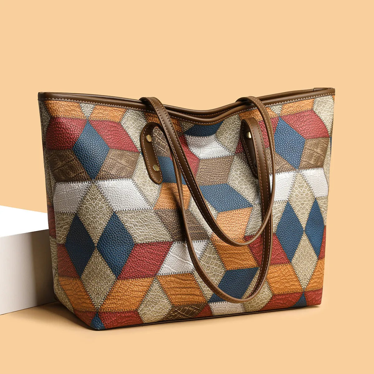 Women's blue brown PVC shoulder handbag with sandwich pocket design and large main compartment