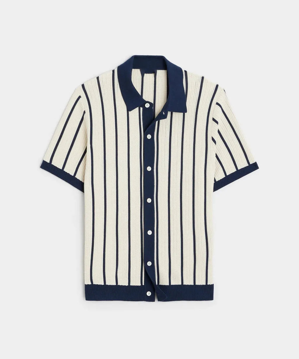 White men's lapel knitted short sleeve shirt with asymmetric stripe design on a hanger.