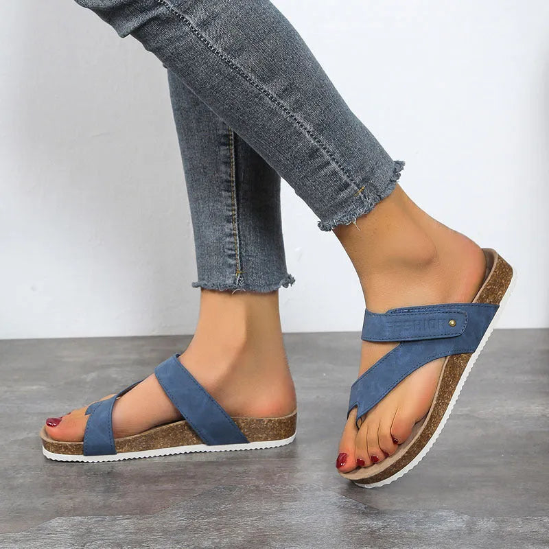 Flat thick-soled toe ring flip-flops in blue, showing artificial PU upper and foam sole.