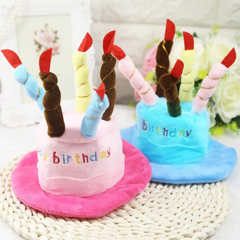 Blue and pink soft birthday hat for small dog on white background.