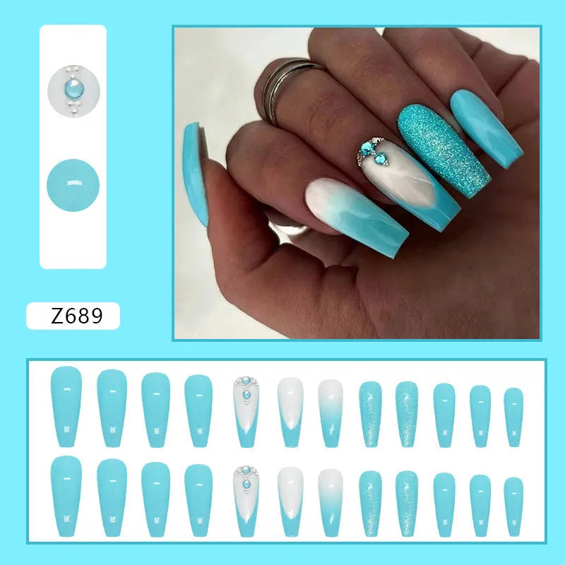 Long ballet style false nails with solid smart blue diamond colour and adhesive glue