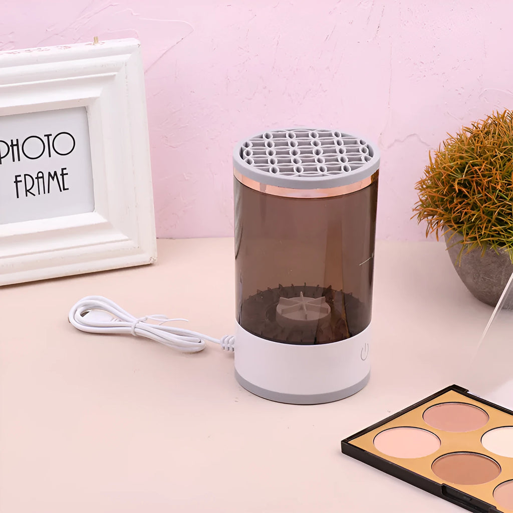 Electric makeup brush cleaner in grey and white with brush inserted, 17x9x9 cm, USB charging