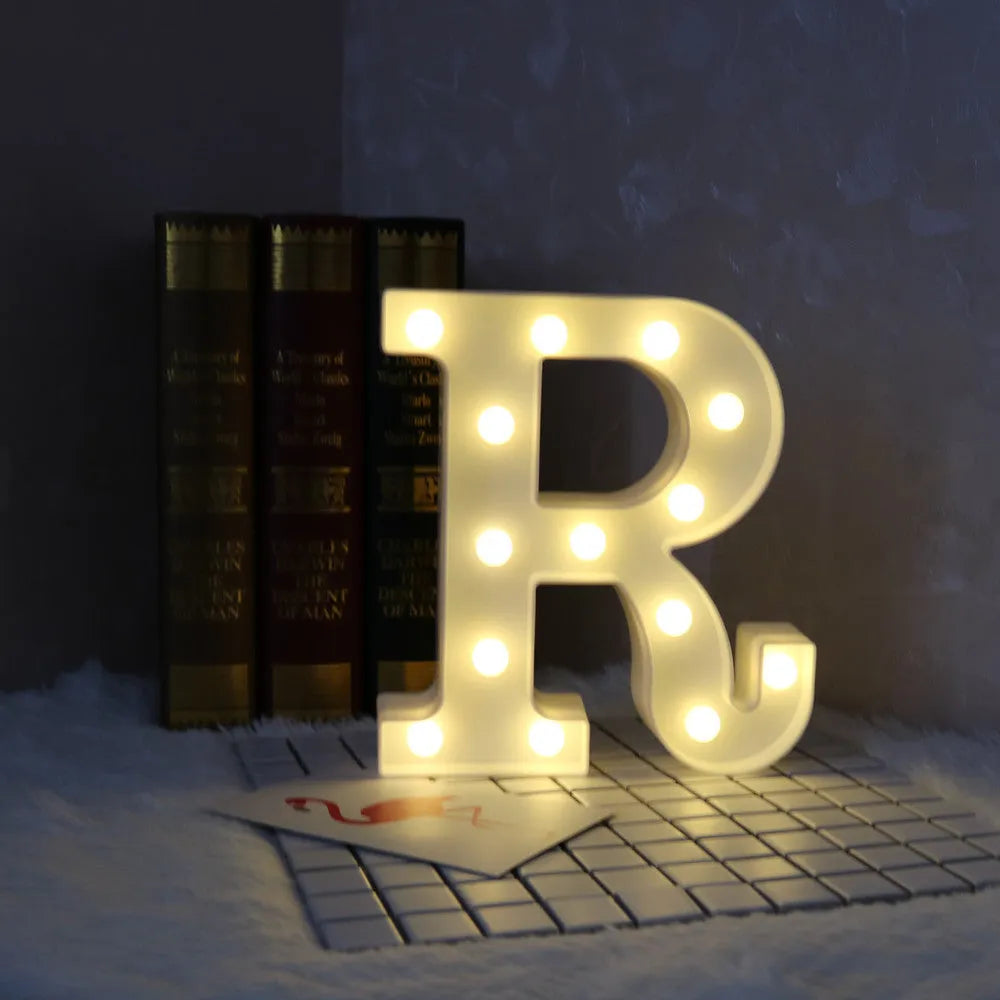White plastic LED marquee letter sign with warm white glow, 22cm tall