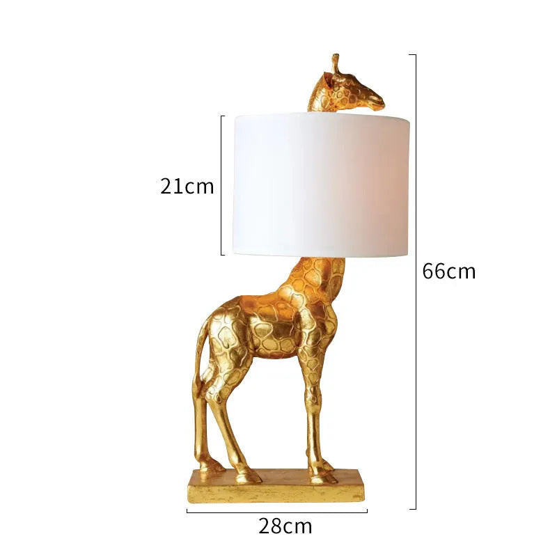 Giraffe table lamp with resin base and cloth shade, 66cm high, in white finish on a bedside table