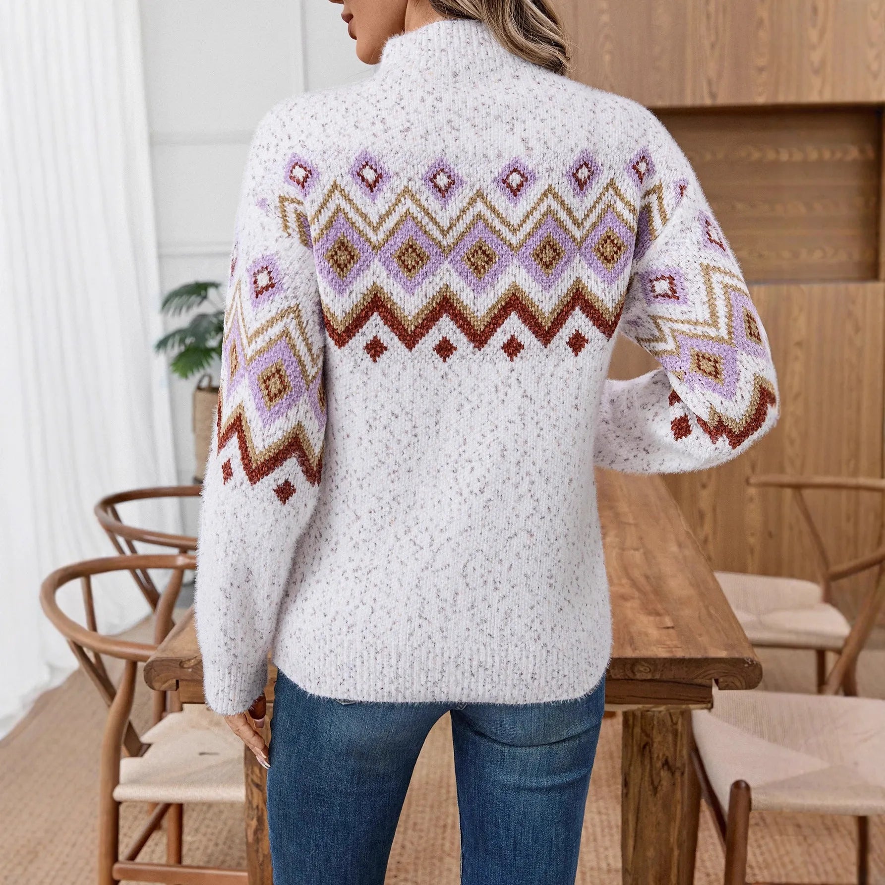White loose geometric jacquard sweater with a half turtleneck collar.