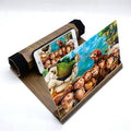 Wood grain mobile phone amplifier measuring 25.5cm wide with phone resting on display stand