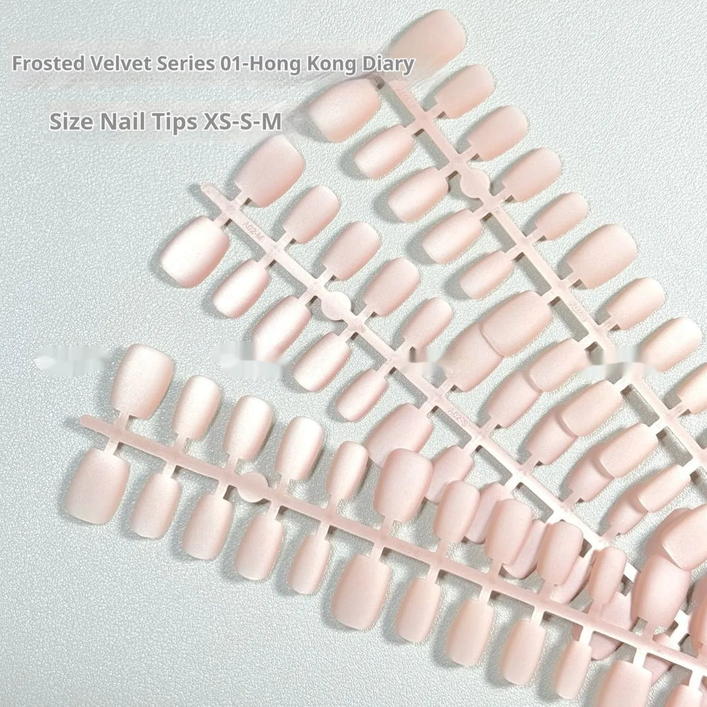 Set of frosted velvet Cat's Eye press-on nails with Aurora shimmer in short ladder sizes XS, S, and M.