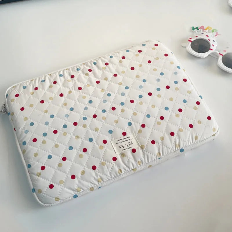 Women's polka dot laptop bag in polyester with breathable construction showing size options