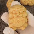 Solid bamboo carving ornament with traditional take money design measuring 4.5cm height