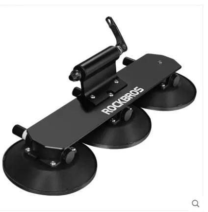 Bicycle suction cup roof rack made of aluminium alloy and rubber in red and black on a car roof
