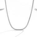 Women's sterling silver necklace with round design and diamond treatment on 925 silver chain