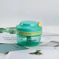 Green manual baby food maker and garlic grinder with 300ml container and stainless steel blade.