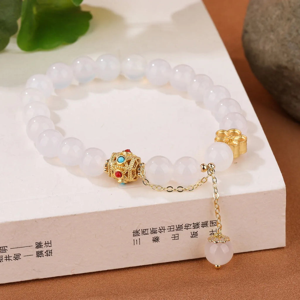Natural agate bracelet with peach blossom copper parts showing 8mm bead size