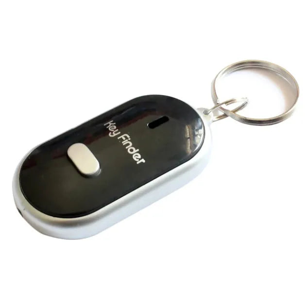 Small ABS key finder device on a keychain, available in black, blue, red, and white colours, with whistle activation