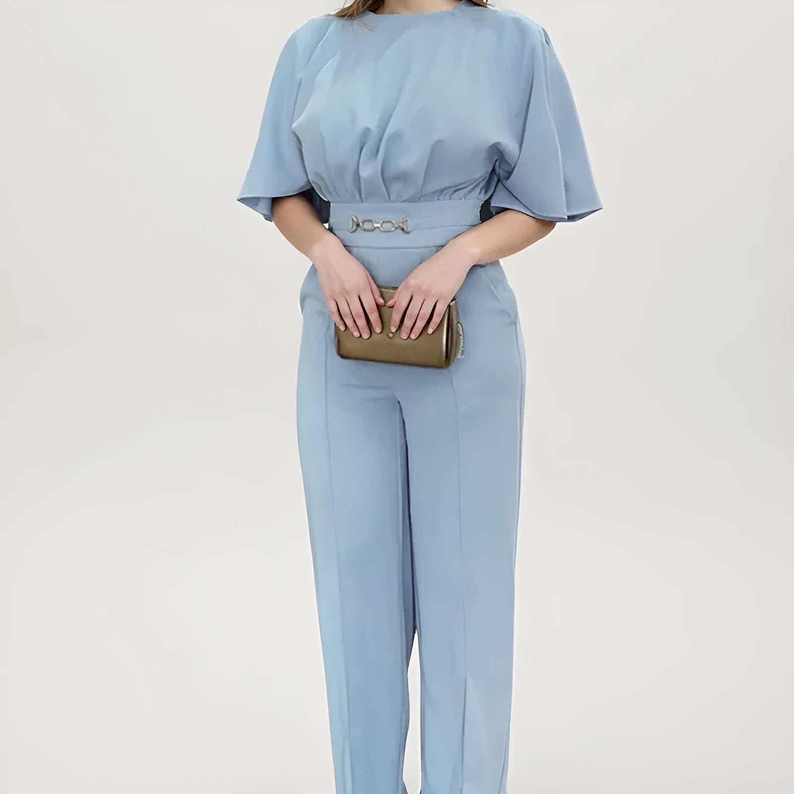 Blue men's two-piece polyester suit on a hanger, showing jacket and trousers.