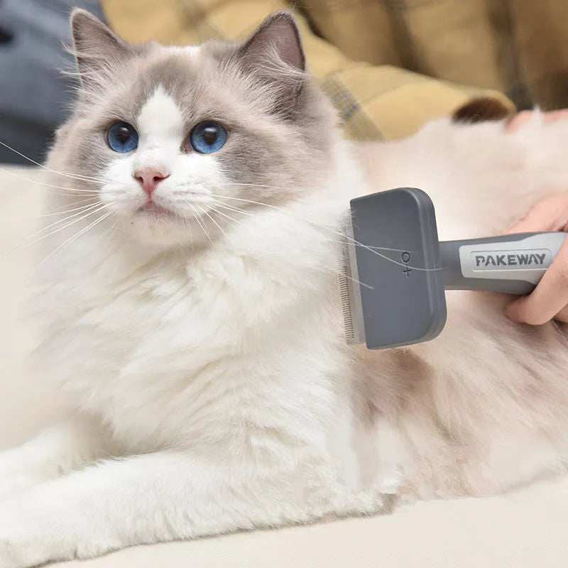 T9 series pet hair removal comb in pink, mint green, and grey on white background