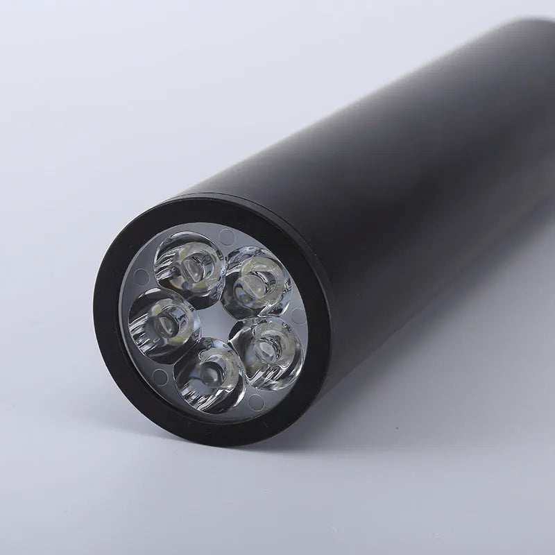 Black round surface mounted LED ceiling downlight spotlight with a 6cm diameter.