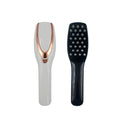 USB rechargeable light therapy massage comb with black ABS silicone body on white background