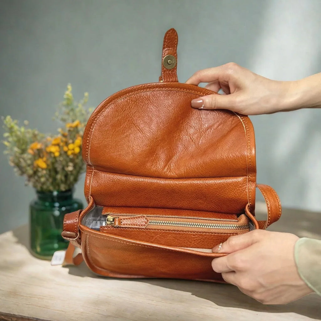 Brown genuine cowhide leather retro messenger bag with flap closure and crossbody strap