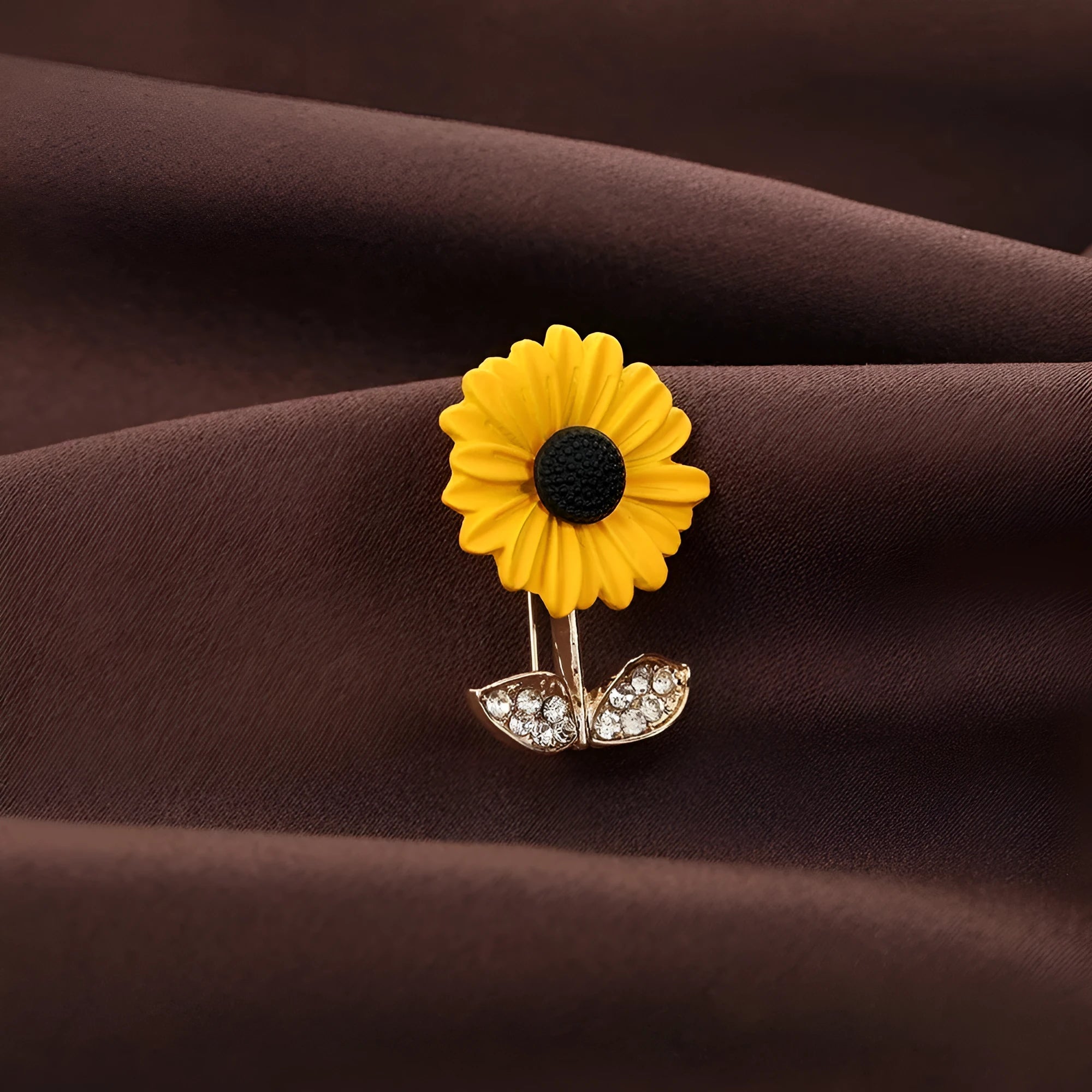 Close-up of a sunflower brooch pin for women, alloy electroplated finish, 2.4 cm by 3.1 cm size