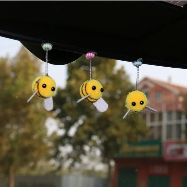 Soft fur ball Swing Spring Bee car decoration ornament measuring 3 by 3 centimetres.