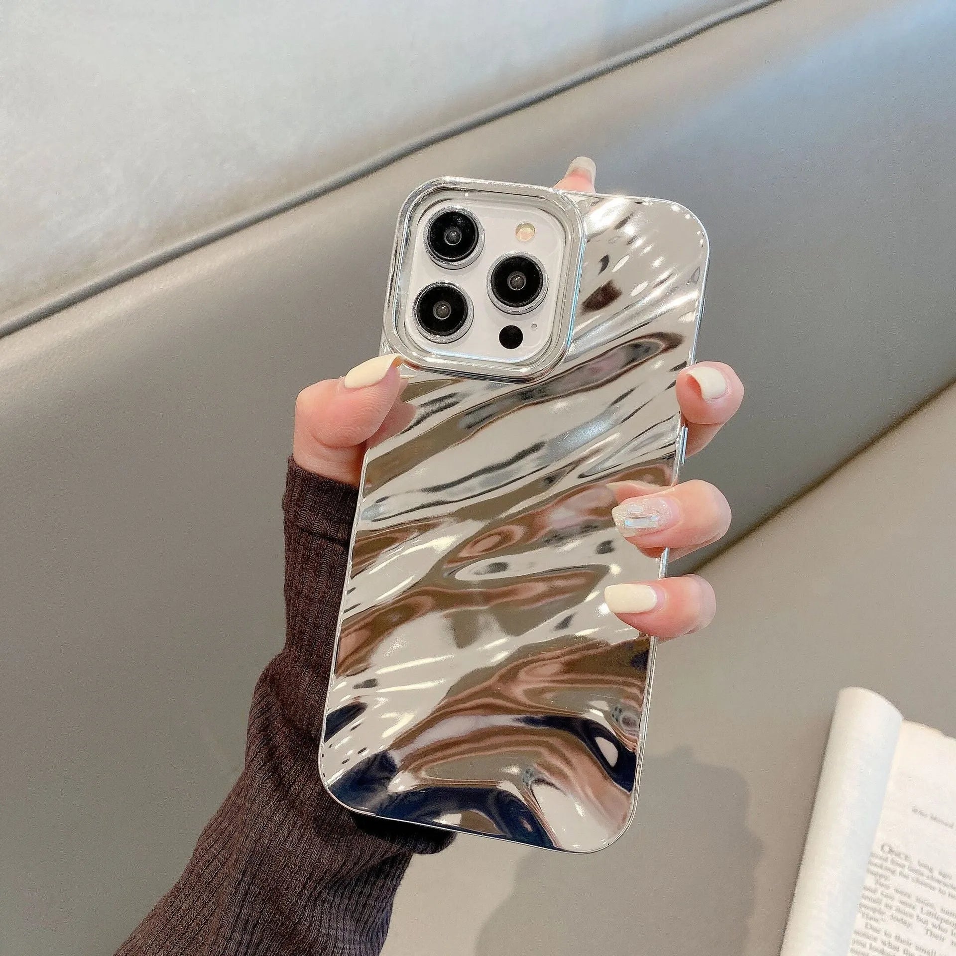 Soft wave pleated TPU phone case for Apple iPhone 17 in a selection of colours including electroplated gold and matte purple.
